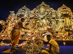 A Hindu priest performs rituals before the idol of Goddess Durga at a community pandal, in Kolkata. Officials of community committees organising big-budget Durga Puja pandals in the city are in hope that Covid situation would not deteriorate so that they can make the entrance more accessible. A Hindu priest performs rituals before the idol of Goddess Durga at a community pandal, in Kolkata. Officials of community committees organising big-budget Durga Puja pandals in the city are in hope that Covid situation would not deteriorate so that they can make the entrance more accessible. 
