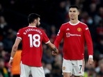Bruno Fernandes (L) with Cristiano Ronaldo