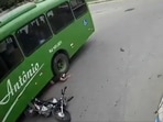 A biker escaped death even after coming head-first under a bus wheel on Monday. (Image source: Screenshot of Twitter video) A biker escaped death even after coming head-first under a bus wheel on Monday. (Image source: Screenshot of Twitter video)