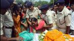 Family member of Jharkhand Police sub-inspector Sandhya Topno, who was mowed down during a vehicle check, mourn near her mortal remains, in Ranchi on Wednesday. (ANI) Family member of Jharkhand Police sub-inspector Sandhya Topno, who was mowed down during a vehicle check, mourn near her mortal remains, in Ranchi on Wednesday. (ANI)