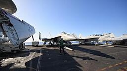 F/A-18 Hornet fighter jets are stationed on the deck of the US Nimitz-class nuclear-powered aircraft carrier USS Harry S Truman, during an exercise on eastern Mediterranean Sea on May 23, 2022. (AFP)