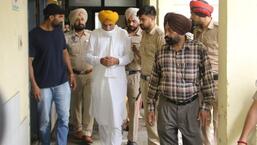 Balkaur Singh, the father of Punjabi singer Sidhu Moose Wala, at Amritsar Civil Hospital after identifying the bodies of the two gangsters.  (Sameer Sehgal/HT)