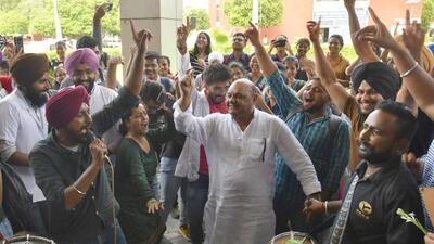 Ludhiana West MLA Gurpreet Bassi Gogi dancing to the beats of dhol with GADVASU interns after they called off their strike in Ludhiana. (Harvinder Singh/HT)