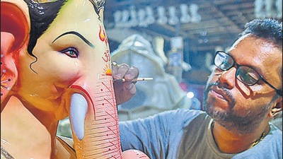 An artist gives finishing touches to an idol of Ganesh in Mumbai PTI An artist gives finishing touches to an idol of Ganesh in Mumbai PTI