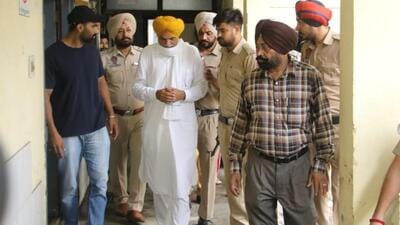 Balkaur Singh, the father of Punjabi singer Sidhu Moose Wala, at the Amritsar civil hospital after identifying the bodies of the two gangsters. (Sameer Sehgal/HT)