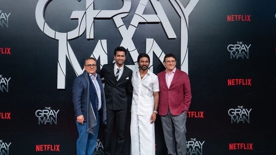 Actor Vicky Kaushal attended Dhanush-starrer The Gray Man's premiere on Wednesday in Mumbai. In this picture, Vicky and Dhanush are seen posing with director duo Russo Brothers. Apart from Dhanush, The Gray Man also stars Ryan Gosling, Ana de Armas, Chris Evans and Rege-Jean Page.