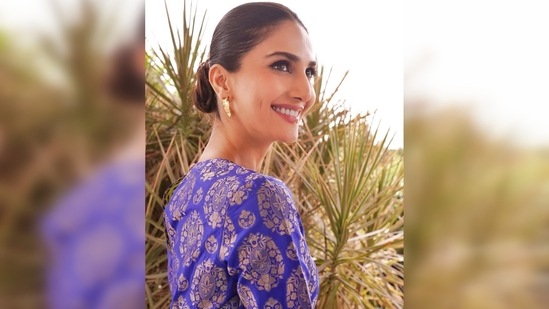 Vaani Kapoor tied her hair back in a neat sleek low bun and opted for the soft glam makeup look featuring subtle smokey eyes and glossy nude lips.(Instagram/@_vaanikapoor_)
