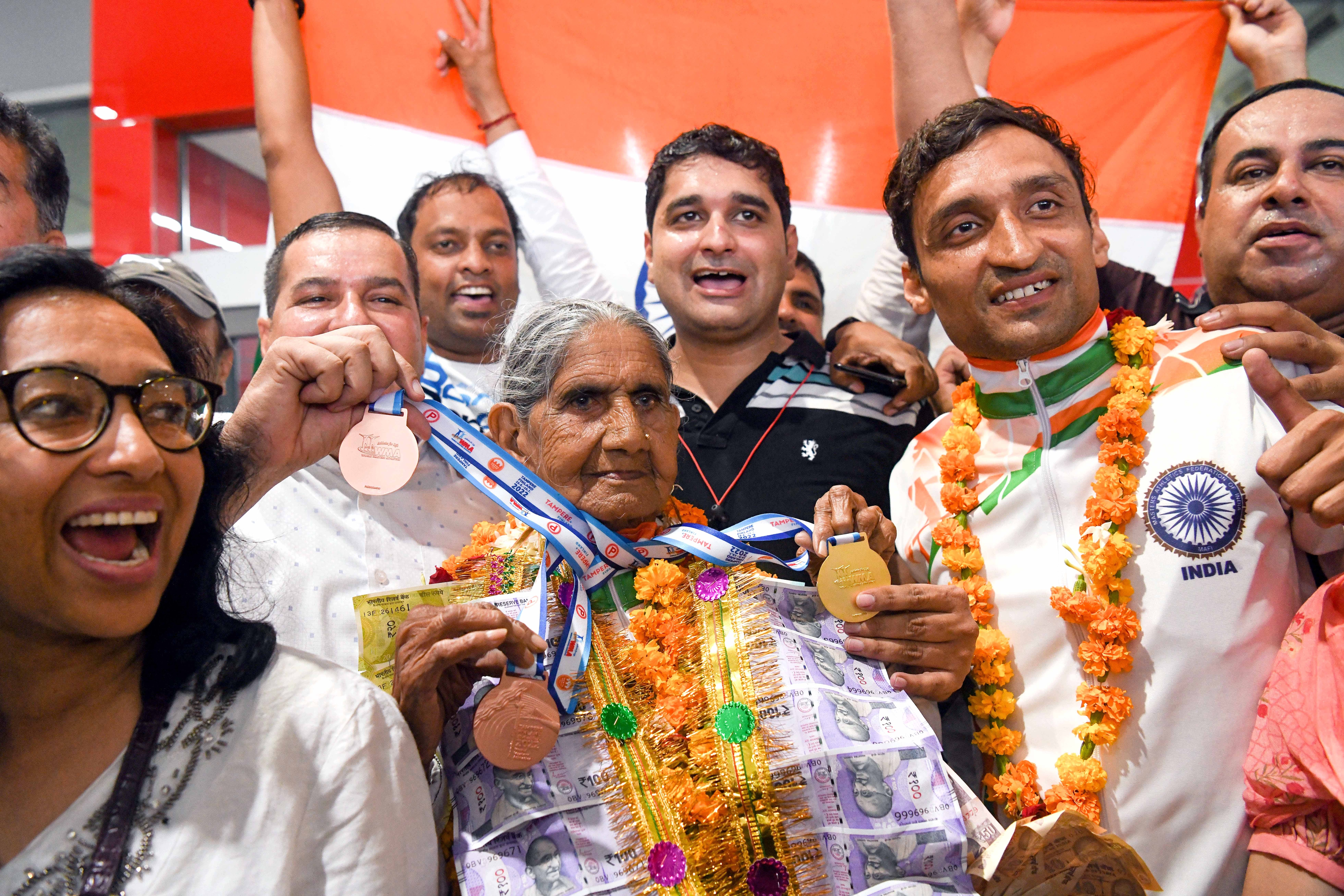 Para athlete Vikas Dagar (second from right) has been coaching his grandmother Bhagwani Devi Dagar (centre) in her journey so far. (Photo: Prateek Kumar/ANI)