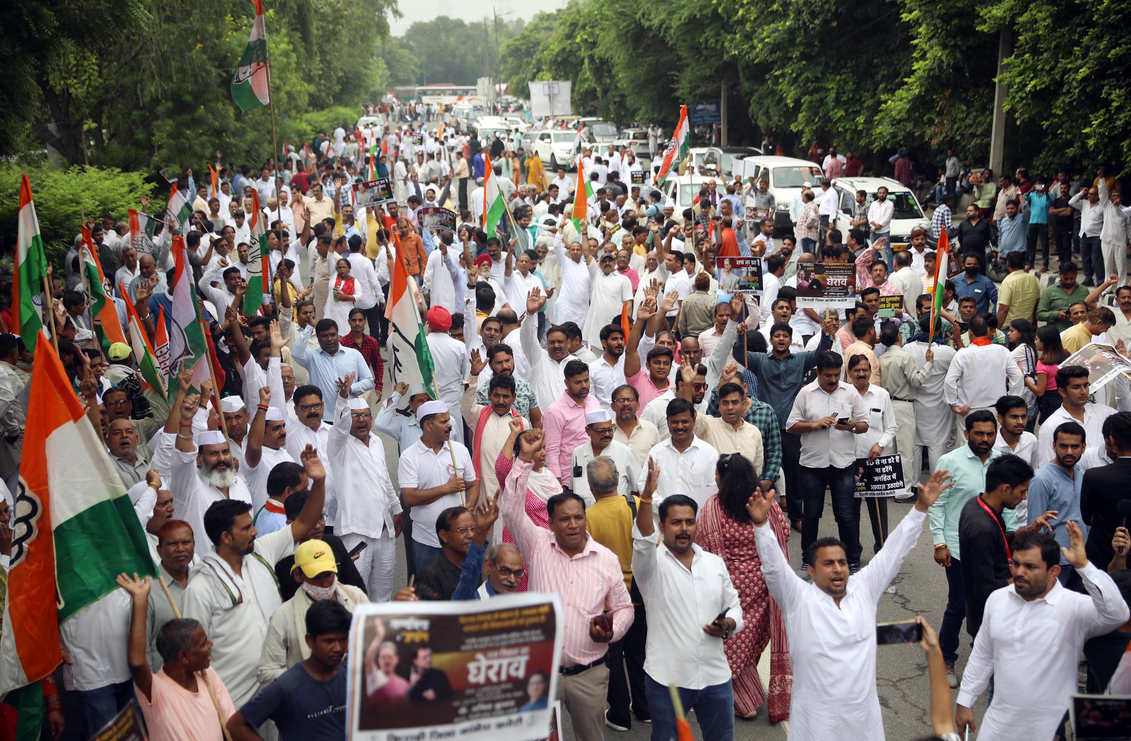 Congress supporters raise slogans during a protest against ED summons to Sonia Gandhi in connection with the National Herald case, in New Delhi. (ANI Photo) Congress supporters raise slogans during a protest against ED summons to Sonia Gandhi in connection with the National Herald case, in New Delhi. (ANI Photo)