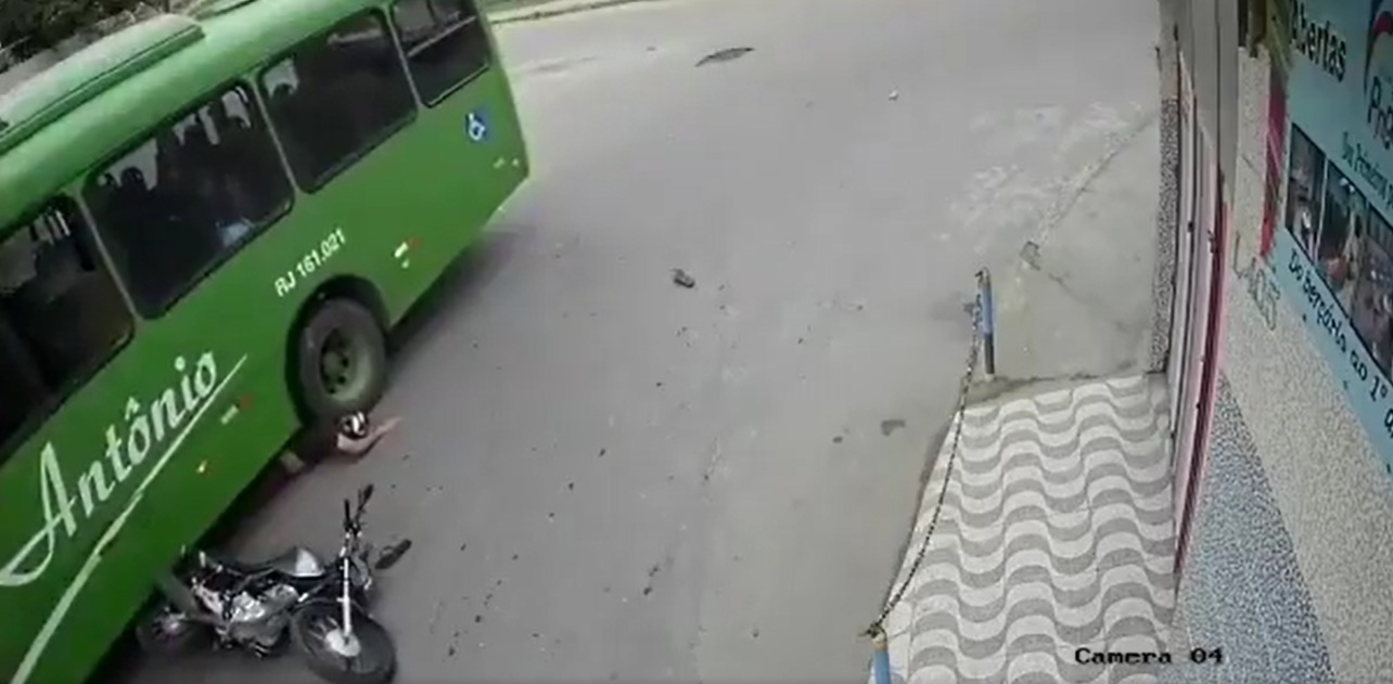 A biker escaped death even after coming head-first under a bus wheel on Monday. (Image source: Screenshot of Twitter video) A biker escaped death even after coming head-first under a bus wheel on Monday. (Image source: Screenshot of Twitter video)