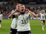 Germany's Alexandra Popp celebrates with Jule Brand, centre left, after scoring her side's second goal during the Women Euro 2022 quarter final soccer match between Germany and Austria at Brentford Community Stadium in London.(AP) Germany's Alexandra Popp celebrates with Jule Brand, centre left, after scoring her side's second goal during the Women Euro 2022 quarter final soccer match between Germany and Austria at Brentford Community Stadium in London.(AP)