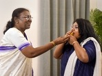 President-elect Droupadi Murmu celebrates with her daughter Itishri Murmu in New Delhi on Thursday. President-elect Droupadi Murmu celebrates with her daughter Itishri Murmu in New Delhi on Thursday. 