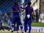 Teammates embrace India's bowler Mohammed Siraj after defeating West Indies by three runs(AP)