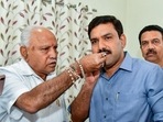 Former Karnataka chief minister BS Yediyurappa with his son BY Vijayendra. (PTI File Photo)