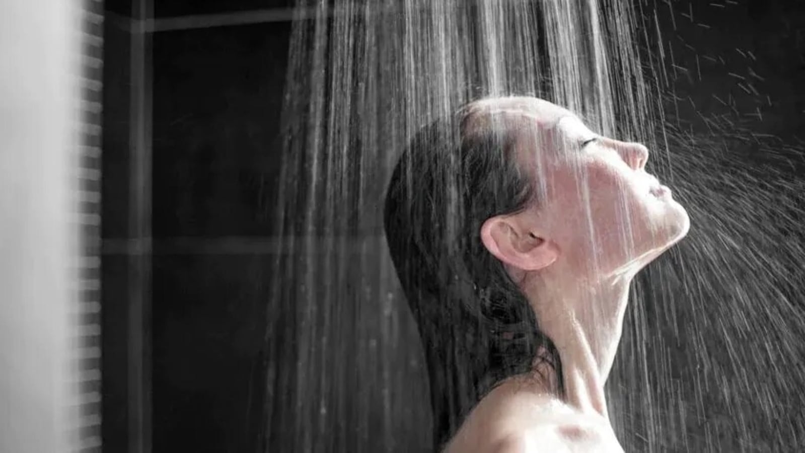 Water dispenser, woman taking cold water into glass from home