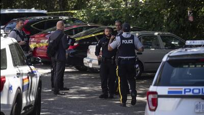 Royal Canadian Mounted Police and Surrey Police officers work at the site where Ripudaman Singh Malik was shot dead in Surrey, British Columbia, Canada, on July 14, 2022. (AP) Royal Canadian Mounted Police and Surrey Police officers work at the site where Ripudaman Singh Malik was shot dead in Surrey, British Columbia, Canada, on July 14, 2022. (AP)