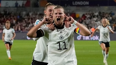 Germany's Alexandra Popp celebrates with Jule Brand, centre left, after scoring her side's second goal during the Women Euro 2022 quarter final soccer match between Germany and Austria at Brentford Community Stadium in London. (AP) Germany's Alexandra Popp celebrates with Jule Brand, centre left, after scoring her side's second goal during the Women Euro 2022 quarter final soccer match between Germany and Austria at Brentford Community Stadium in London. (AP)