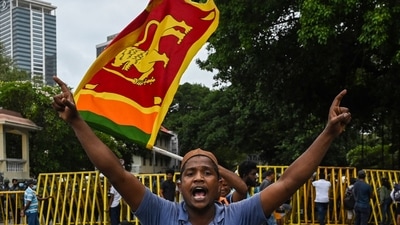 A demonstrator gestures during a protest march towards the Presidential secretariat office against Sri Lankan President Ranil Wickremesinghe, in Colombo. (AFP) A demonstrator gestures during a protest march towards the Presidential secretariat office against Sri Lankan President Ranil Wickremesinghe, in Colombo. (AFP)