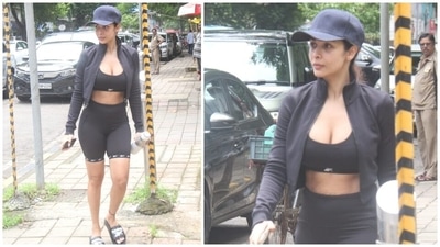 On Friday, Malaika stepped out in Mumbai and was clicked by the paparazzi outside her yoga studio. She chose an all-black look for her workout and paired it with a bare face, flaunting her natural glow. (HT Photo/Varinder Chawla)