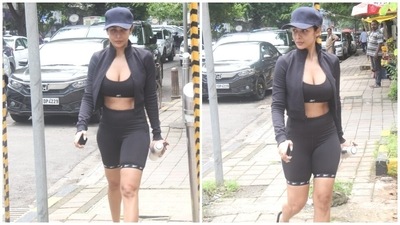 Malaika's gym look features a sleeveless sports bra with a plunging U neckline and a cropped hem flaunting her toned abs. She wore a cropped jacket to layer it over the sports bra. It features an open front, long sleeves and raised collars. (HT Photo/Varinder Chawla)
