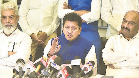 Eknath Shinde faction’s spokesperson Deepak Kesarkar (C) addresses a press conference on Friday. Anshuman Poyrekar/ HT Photo