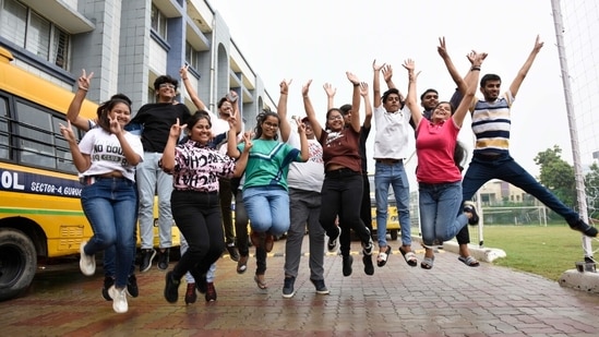 Students of Blue Bells Model Senior Secondary School, Gurugram rejoice after seeing their results.(Parveen Kumar)