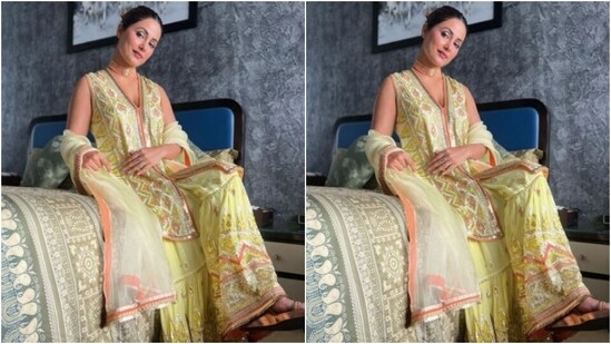 Hina paired her kurta with a long flowy yellow skirt that came designed silver and orange zari and printed in geometric patterns at the ankles. She added a pastel yellow dupatta with silver and orange zari work to her look.(Instagram/@realhinakhan)