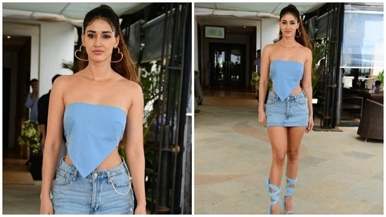 Disha paired the top with a mini denim skirt featuring an embellished silver waist belt, low rise waist, and distressed hem. Lastly, she completed the styling with a pair of heart-shaped hoop earrings, colourful statement rings, a sleek gold chain, and high heels with gladiator straps.(HT Photo/Varinder Chawla)