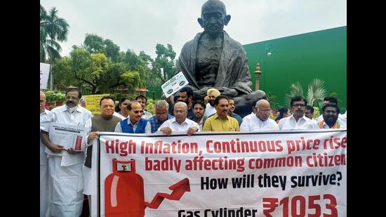 Opposition leaders protest over rising inflation near Mahatma Gandhi's statue at the Parliament in New Delhi on Friday. (ANI Photo)