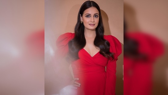 Dia Mirza's dress features drape and ruffle detailing with a plunging neckline and puffed shoulder sleeves.(Instagram/@diamirzaofficial)