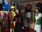 FILE - Ajmal Haqiqi, right, watches as Mahal Wak, center, practices modeling, in Kabul, Afghanistan, Aug. 3, 2017. The Taliban have detained a famous Afghan fashion model along with three colleagues, including Haqiqi, accusing them of disrespecting Islam and the Holy Quran. FILE - Ajmal Haqiqi, right, watches as Mahal Wak, center, practices modeling, in Kabul, Afghanistan, Aug. 3, 2017. The Taliban have detained a famous Afghan fashion model along with three colleagues, including Haqiqi, accusing them of disrespecting Islam and the Holy Quran. 