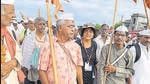 Nandini Dias walking with the flag bearers leading the Yatra, followed by chanters, dholak players and cymbal players. Nandini Dias walking with the flag bearers leading the Yatra, followed by chanters, dholak players and cymbal players.