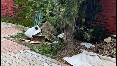 Broken objects dumped outside the gates on the southern side of House Number-7 in the CM’s residential complex. (HT Photo)