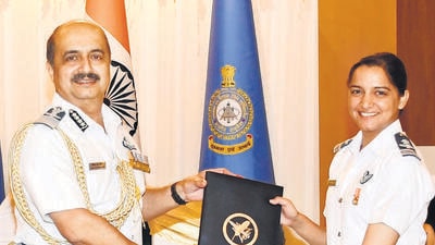 IAF chief Air Chief Marshal VR Chaudhari with Squadron Leader Bhoomika Paliwal. IAF chief Air Chief Marshal VR Chaudhari with Squadron Leader Bhoomika Paliwal.