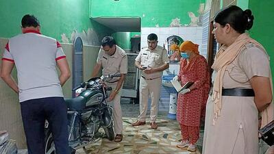 The police and Forensic Science Laboratory (FSL) officials examine the spot of the crime where the elderly couple was shot dead in Rohtak on Saturday. Property dispute is stated to be the reason behind the killing. (Manoj Dhaka/HT)