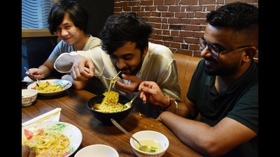 A warm bowl of soupy noodles in rainy weather, and you enjoying it with your group of friends. Can it get any better? (Photo: Manish Rajput/ HT)