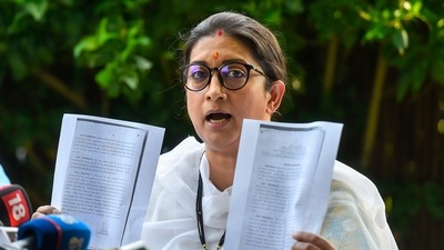 Union minister Smriti Irani addresses a press conference at her residence in New Delhi on Saturday, (PTI)