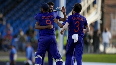 Teammates embrace India's bowler Mohammed Siraj after defeating West Indies by three runs in their first ODI cricket match at Queen's Park Oval (AP) Teammates embrace India's bowler Mohammed Siraj after defeating West Indies by three runs in their first ODI cricket match at Queen's Park Oval (AP)