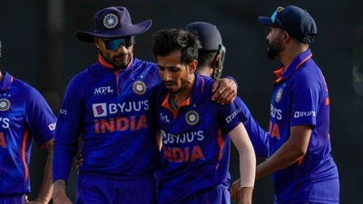 India's captain Shikhar Dhawan embraces Yuzvendra Chahal&nbsp;during the first ODI cricket match against West Indies at Queen's Park Oval in Port of Spain (AP)