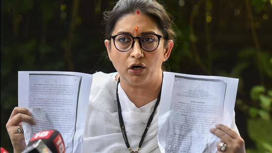 Union minister Smriti Irani addresses a press conference at her residence in New Delhi on Saturday. (PTI)