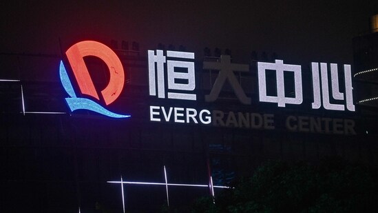 Evergrande's woes have had knock-on effects throughout China's property sector, with some smaller firms also defaulting on loans and others struggling to find enough cash. (Photo by Hector RETAMAL/AFP)