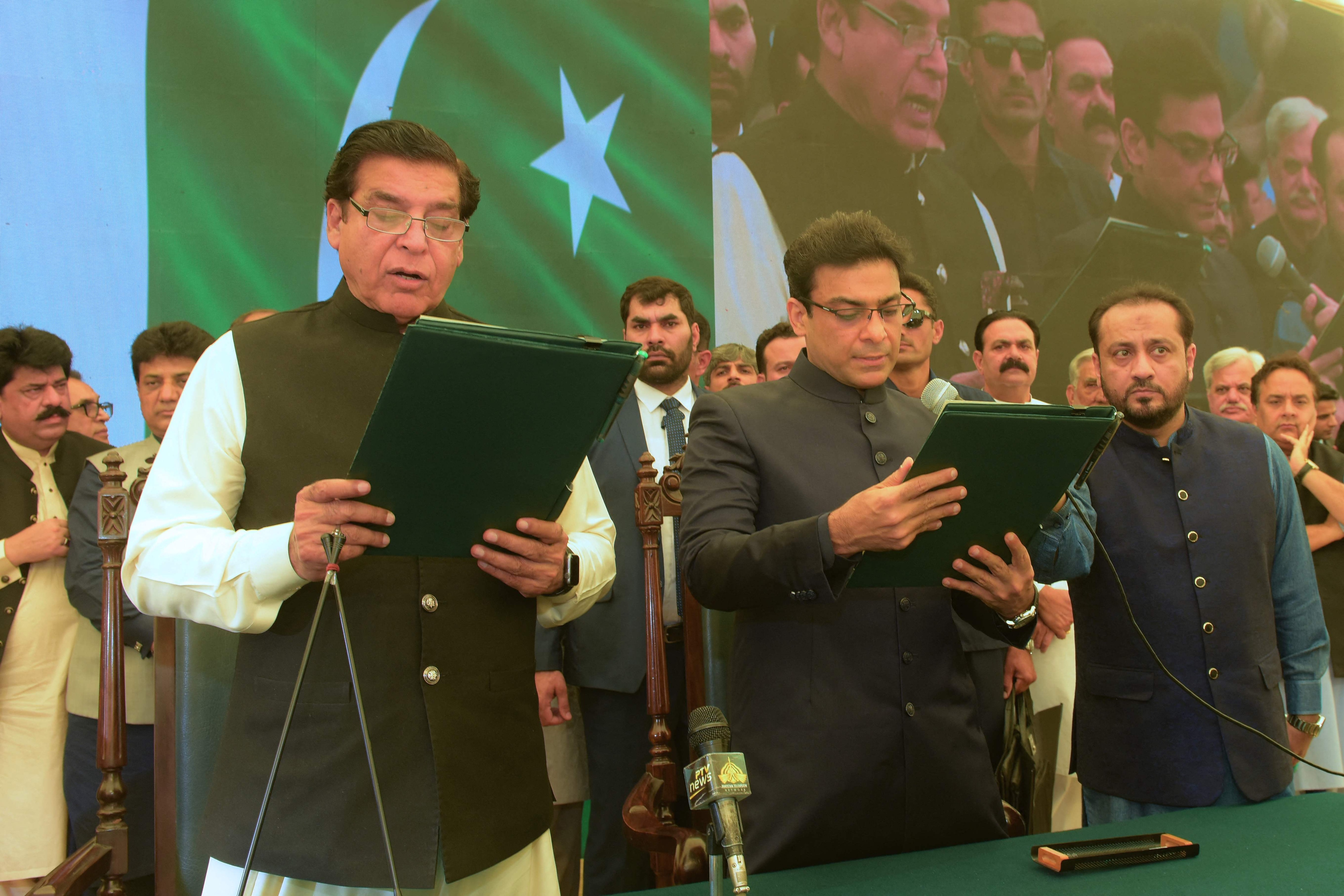 Speaker of the national assembly Raja Pervez Ashraf (L) administers the oath to Hamza Shehbaz Sharif (C) as the chief minister of Punjab province in Lahore. (AFP) Speaker of the national assembly Raja Pervez Ashraf (L) administers the oath to Hamza Shehbaz Sharif (C) as the chief minister of Punjab province in Lahore. (AFP)