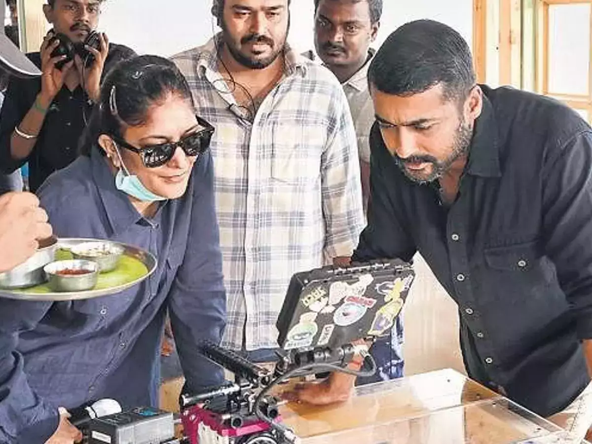 Sudha Kongara and Suriya on the sets of Soorarai Pottru. Sudha Kongara and Suriya on the sets of Soorarai Pottru.