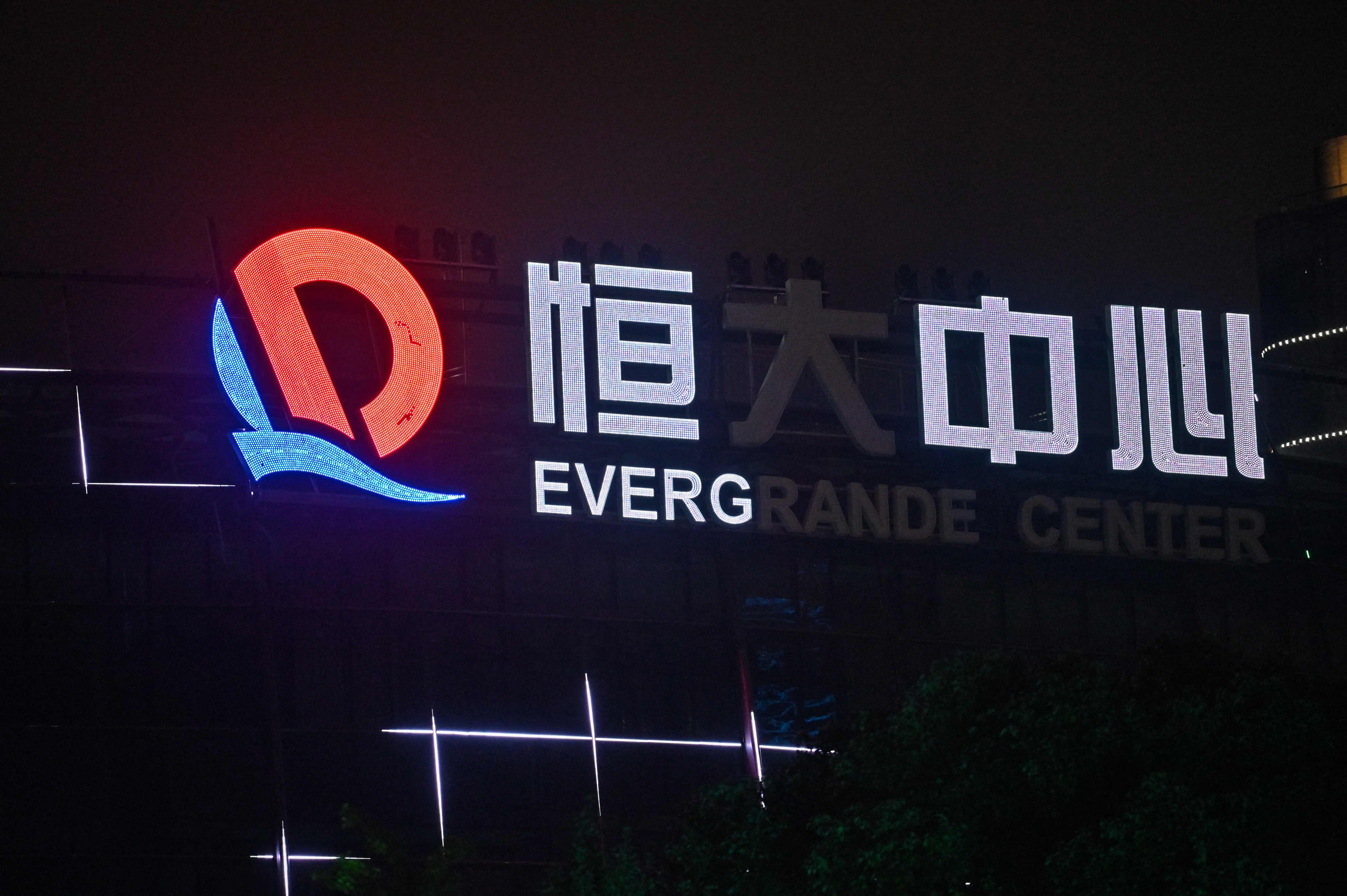 Evergrande's woes have had knock-on effects throughout China's property sector, with some smaller firms also defaulting on loans and others struggling to find enough cash. (Photo by Hector RETAMAL/AFP) Evergrande's woes have had knock-on effects throughout China's property sector, with some smaller firms also defaulting on loans and others struggling to find enough cash. (Photo by Hector RETAMAL/AFP)