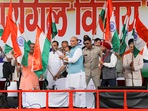 Defence minister Rajnath Singh waves the national flag during a programme commemorating Kargil Vijay Diwas in Jammu, Sunday. Defence minister Rajnath Singh waves the national flag during a programme commemorating Kargil Vijay Diwas in Jammu, Sunday.