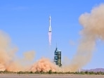 The Long March-2F carrier rocket, carrying the Shenzhou-14 spacecraft and three astronauts, launching from Jiuquan Satellite Launch Center last month. (cnsphoto via REUTERS)