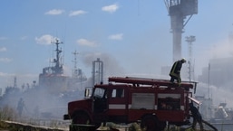 Firefighters work at a site of a Russian missile strike in a sea port of Odesa, as Russia's attack on Ukraine continues, Ukraine July 23, 2022. (Press service of the Joint Forces of the South Defence/Handout via REUTERS)