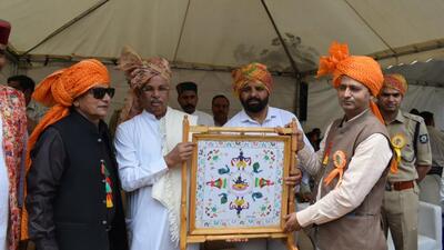 Himachal Pradesh governor Rajendra Vishwanath Arelkar being presented a traditional Chamba rumal at the inauguration of the Minjar Mela (HT Photo) Himachal Pradesh governor Rajendra Vishwanath Arelkar being presented a traditional Chamba rumal at the inauguration of the Minjar Mela (HT Photo)