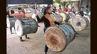 A dhol-tasha troupe practice near Nehru stadium. (HT PHOTO)