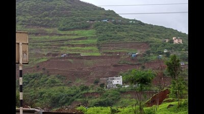 Illegal construction seen over the new Kartaj tunnel at Shindewadi (NH-4) on Sunday. (Ravindra Joshi/HT PHOTO) Illegal construction seen over the new Kartaj tunnel at Shindewadi (NH-4) on Sunday. (Ravindra Joshi/HT PHOTO)